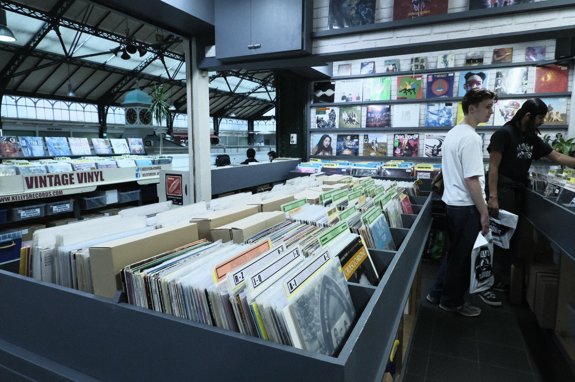 The racks. Pre-owned first, every genre, every generation.